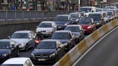 Cars are seen stuck in a traffic jam on a road heading towards central Brussels during the morning rush hour