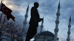 A statue of modern Turkey's founder Ataturk and a mosque in the background are pictured in a square where Turkish Prime Minister Tayyip Erdogan (not pictured) is to attend an election rally of his of ruling AK Party (AKP) in Kirikkale, central Turkey Mar