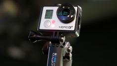 A GoPro Hero 3+ camera is seen at the Nasdaq Market Site before before GoPro Inc's IPO in New York City, June 26, 2014. Wearable sports camera maker GoPro Inc's initial public offering was priced at $24 per share, an underwriter said, valuing the company 