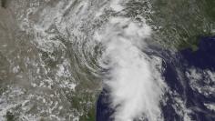 The center of Tropical Storm Bill is seen making landfall on Matagorda Island, Texas