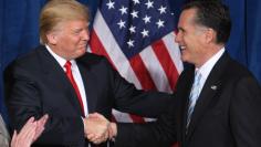 Donald Trump and Mitt Romney shake hands after Trump endorsed his candidacy for president, February 2, 2012.  REUTERS/Steve Marcus 