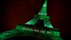 FILE PHOTO: The Eiffel tower is illuminated in green with the words "Paris Agreement is Done", to celebrate the Paris U.N. COP21 Climate Change agreement in Paris, France, November 4, 2016. REUTERS/Jacky Naegelen/File Photo