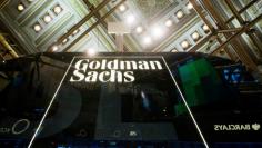FILE PHOTO - A Goldman Sachs sign is seen above the floor of the New York Stock Exchange shortly after the opening bell in the Manhattan borough of New York, U.S. on January 24, 2014.  REUTERS/Lucas Jackson/File Photo 