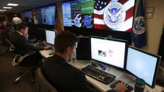U.S. Department of Homeland Security employees work during a guided media tour inside the National Cybersecurity and Communications Integration Center in Arlington, Virginia in this file photo taken on June 26, 2014. REUTERS/Kevin Lamarque 