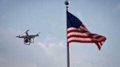 FILE PHOTO: A small drone helicopter flies over Coney Island in New York