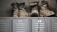 Coal mining boots are shown above miners' lockers before the start of an afternoon shift at a coal mine near Gilbert, West Virginia May 22, 2014.     REUTERS/Robert Galbraith/File Photo
