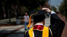 A graduate holds their mortarboard cap after a commencement ceremony at the University of Southern California (USC) in Los Angeles, California, U.S., May 12, 2017. REUTERS/Patrick T. Fallon 