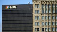 The NBC logo is picture atop their office building in San Diego, California  September 1, 2015. REUTERS/Mike Blake - GF10000189520