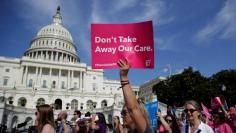 Healthcare activists protest in opposition to the Senate Republican healthcare bill on Capitol Hill in Washington