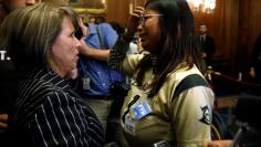 Rep. Michelle Lujan Grisham speaks with DACA recipient Karen Caudillo of Orlando, Florida, after an event by Democrats calling for Congressional Republicans to bring forward immigration legislation on Capitol Hill in Washington, U.S., September 6, 2017. 