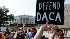 FILE PHOTO: Demonstrators protest in front of the White House after the Trump administration today scrapped the Deferred Action for Childhood Arrivals (DACA), a program that protects from deportation almost 800,000 young men and women who were brought in