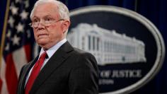 FILE PHOTO: U.S. Attorney General Jeff Sessions stands during a news conference to discuss "efforts to reduce violent crime" at the Department of Justice in Washington, U.S., December 15, 2017.   REUTERS/Joshua Roberts/File Photo