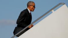 U.S. President Barack Obama boards Air Force One for travel to campaign events in North Carolina from Joint Base Andrews, Maryland, U.S. November 4, 2016. REUTERS/Jonathan Ernst