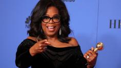 FILE PHOTO: Oprah Winfrey with her Cecil B. DeMille Award at the 75th Golden Globe Awards in Beverly Hills