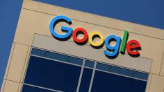 FILE PHOTO - The Google logo is pictured atop an office building in Irvine, California, U.S. August 7, 2017.   REUTERS/Mike Blake/File Picture 