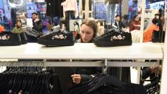 A woman shops at an H&M store in New York City, U.S. December 23, 2017. REUTERS/Stephanie Keith