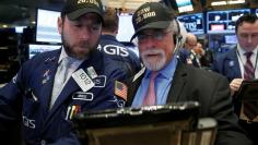 Traders work on the main trading floor of the NYSE as the Dow Jones Industrial Average passes 20,000 after opening of trading session in New York