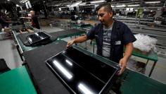 FILE PHOTO: An employee works at an LED TV assembly line at a factory that exports to the U.S. in Ciudad Juarez, Mexico, September 21, 2016. Picture taken September 21, 2016. REUTERS/Jose Luis Gonzalez/File photo 