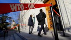 Delegates arrive at the World Trade Organization (WTO) headquarters in Geneva, Switzerland November 22, 2017. REUTERS/Denis Balibouse