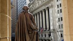 The New York Stock Exchange is seen from the steps of Federal Hall behind a Statue of former U.S. President George Washington in New York City, U.S., May 17, 2017. REUTERS/Brendan McDermid  