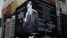 A billboard for late-night talk show host Stephen Colbert is seen near Times Square in the Manhattan borough of New York City