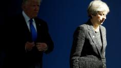 FILE PHOTO - U.S. President Donald Trump (L) and Britain's Prime Minister Theresa May walk at the start of the NATO summit at their new headquarters in Brussels, Belgium, May 25, 2017. REUTERS/Jonathan Ernst 