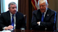 FILE PHOTO - U.S. President Donald Trump, flanked by U.S. Senator Dick Durbin (D-IL), holds a bipartisan meeting with legislators on immigration reform at the White House in Washington, U.S. January 9, 2018.  REUTERS/Jonathan Ernst