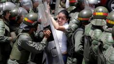 FILE PHOTO: Arellano, deputy of the Venezuelan coalition of opposition parties (MUD), clashes with national guards during a rally against Venezuela's President Nicolas Maduro's government in Caracas