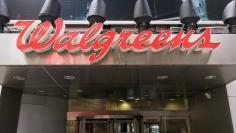 FILE PHOTO: The Walgreens logo is seen outside the store in Times Square in New York, U.S., July 5, 2016.  REUTERS/Shannon Stapleton 