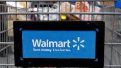 FILE PHOTO: A customer pushes a shopping cart at a Walmart store in Chicago, Illinois, U.S. November 23, 2016. REUTERS/Kamil Krzaczynski/File Photo