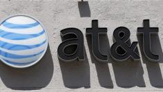 AT&T profit up, helped by iPhone sales drop