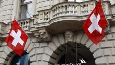 Cuts, bond trading keep Credit Suisse in profit