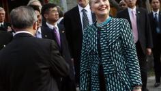 Clinton urges China to help on Iran, North Korea