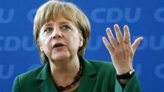 Merkel resists calls to put growth before reforms