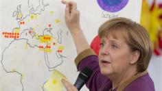 Isolated Merkel sticks by austerity after vote setback