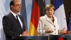 Merkel, Hollande pledge to work together to boost growth