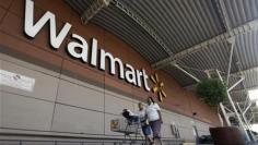 Strong Wal-Mart profit trumps bribery probe concerns