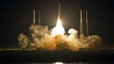 SpaceX capsule docks at space station, opens new era