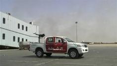 Fighting at Tripoli airport, gunmen surround planes