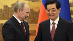 Putin says to push military ties with China