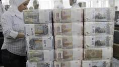 Exclusive: Syria prints new money as deficit grows: bankers