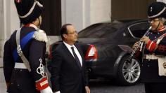 France's Hollande plays euro poker with Merkel