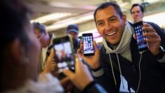 Apple faithful line up for latest, larger iPhones