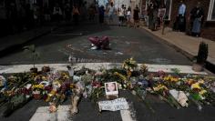Flowers and a photo of car ramming victim Heather Heyer lie at a makeshift memorial in Charlottesville