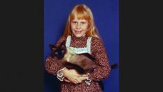 Amy Carter, daughter of Jimmy Carter (1977-81), holds her Siamese cat, Misty Malarky Ying Yang.