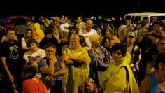 People wait to receive a wristband number for medical treatment at the Remote Area Medical (RAM) clinic in Wise, Virginia on July 20, 2012. RAM clinics bring free medical, dental and vision care to uninsured and under-insured people across the country and